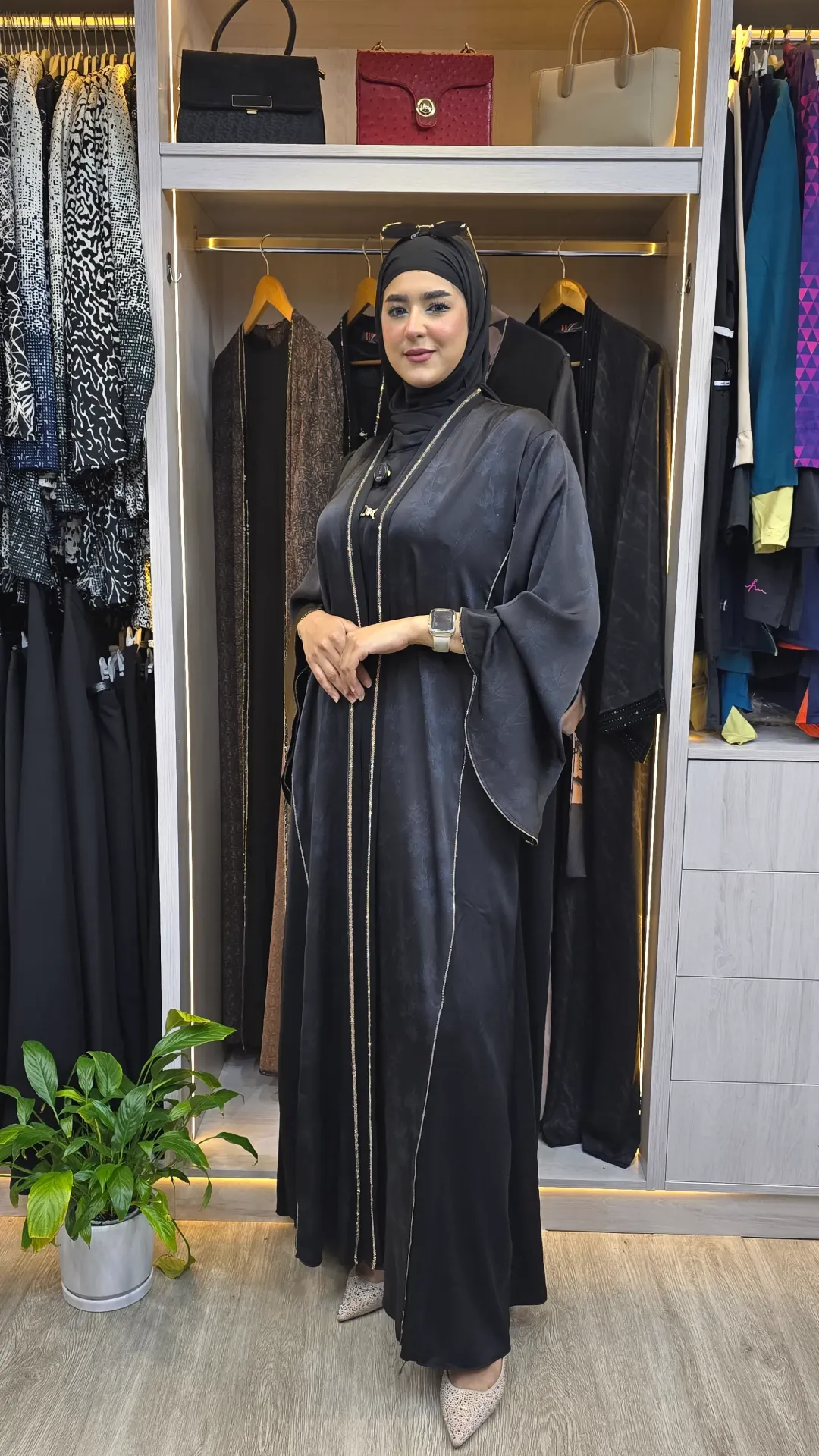 A luxurious two-piece black abaya