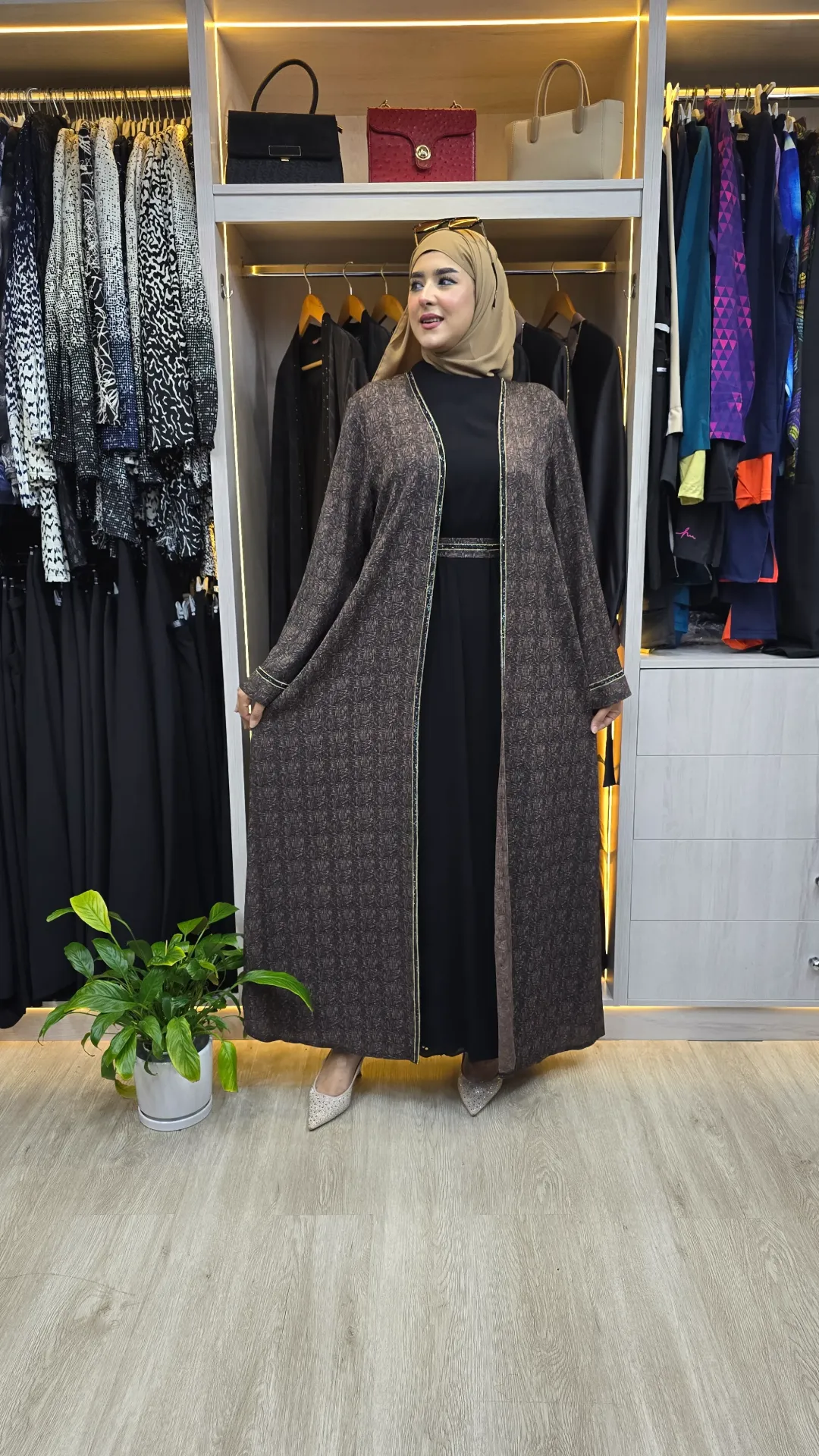 A luxurious embellished two-piece abaya