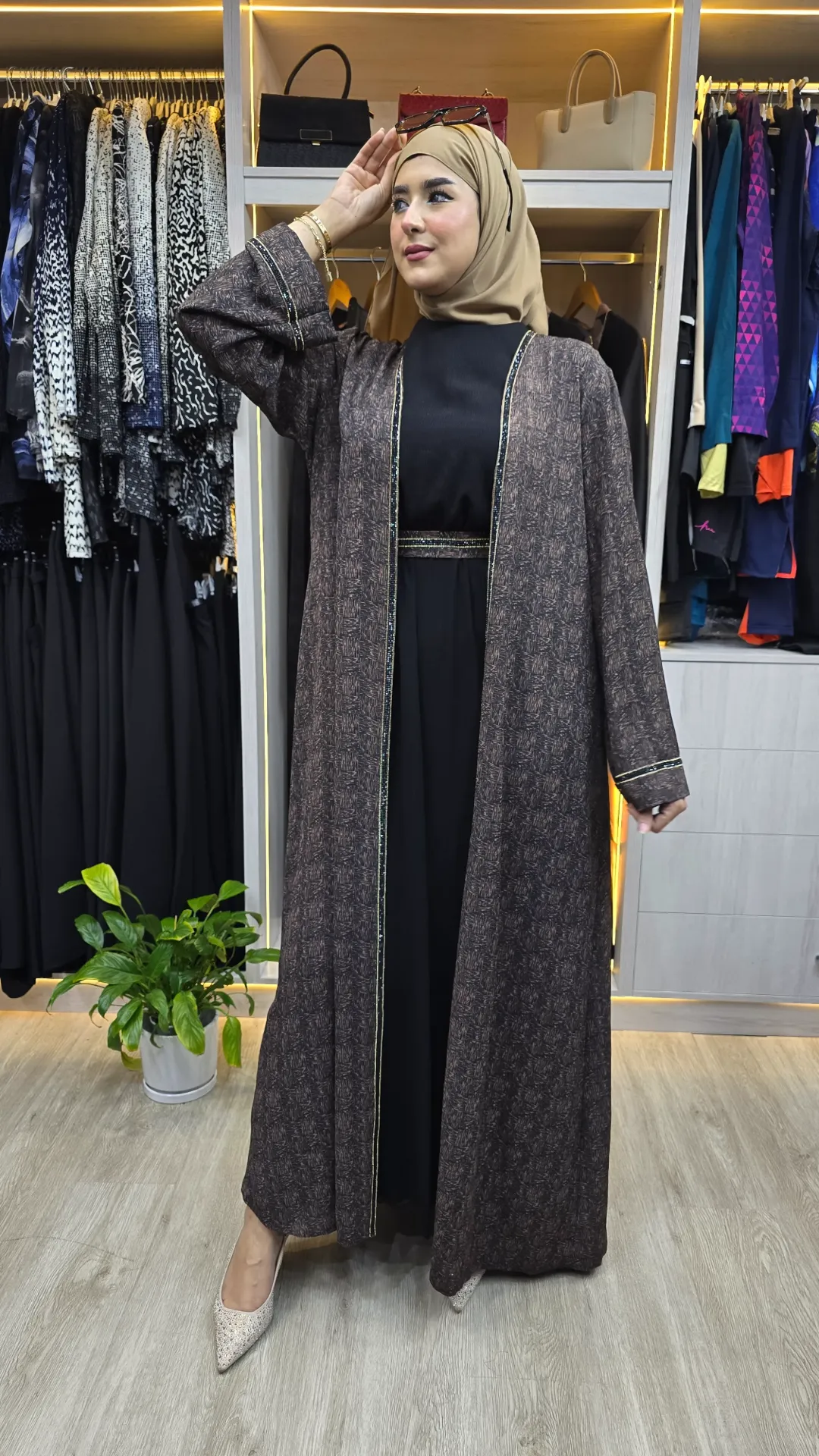 A luxurious embellished two-piece abaya